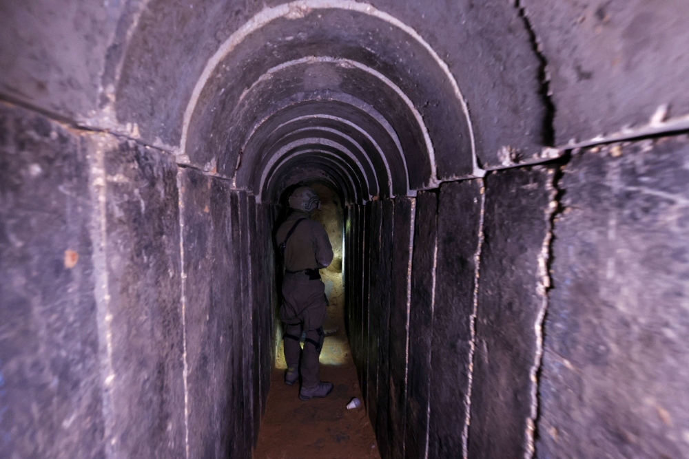 An Israeli soldier in what the army says is a tunnel dug by Hamas under the Al-Shifa hospital complex in Gaza City. — Reuters pic