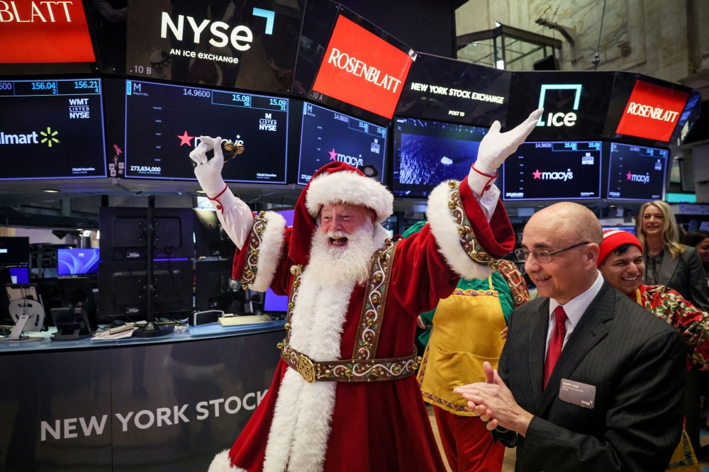 Macy's Santa Claus appears on the trading floor to celebrate the 97th Macy's Thanksgiving Day Parade at the New York Stock Exchange (NYSE) in New York City November 22, 2023. — Reuters pic