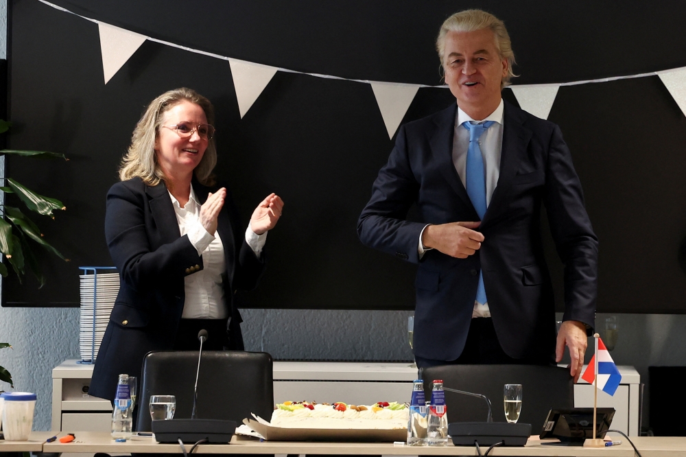 Dutch far-right politician and leader of the PVV party, Geert Wilders gestures as he meets with members of his party at the Dutch Parliament, after the Dutch parliamentary elections, in The Hague, Netherlands November 23, 2023. — Reuters pic