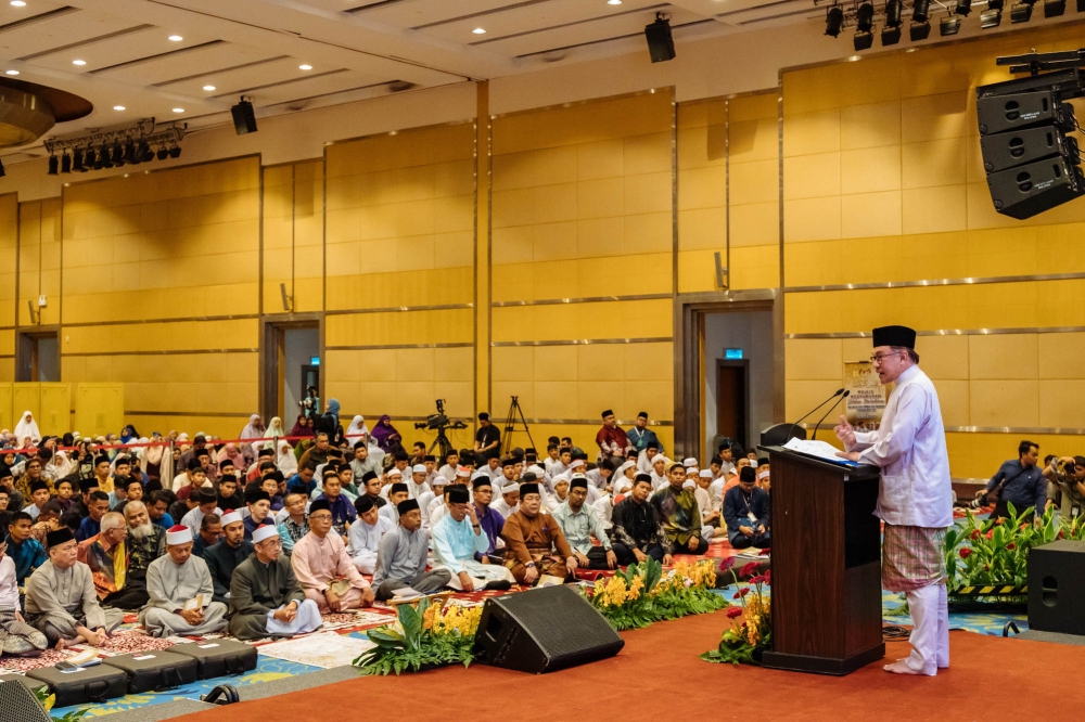 Prime Minister Datuk Seri Anwar Ibrahim speaks at a thanksgiving ceremony in conjunction with the Madani Government One Year Anniversary at Dewan Seri Siantan in Putrajaya, November 23, 2023. — Picture by Firdaus Latif