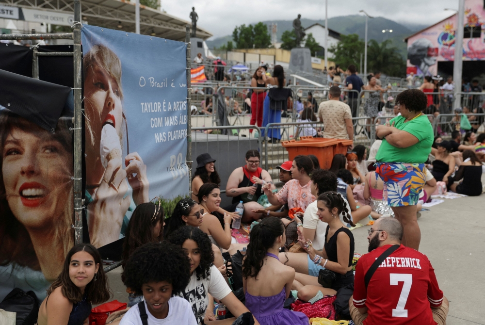  Fans wait in line outside Nilton Santos stadium for the Taylor Swift concert, following the death of a fan due to the heat during the first day concert, in Rio de Janeiro, Brazil, November 20, 2023. — Reuters pic