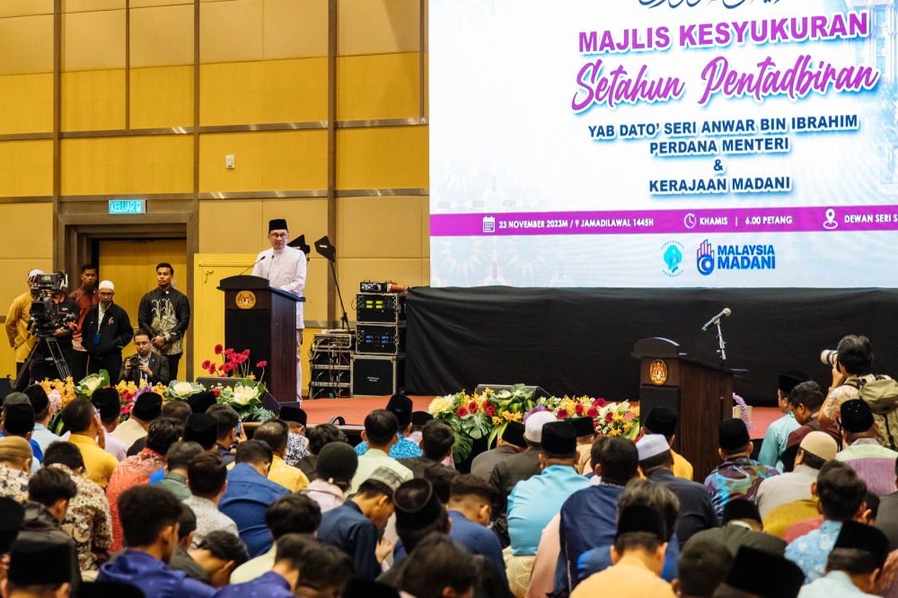 Prime Minister Datuk Seri Anwar Ibrahim speaks at a thanksgiving ceremony in conjunction with the Madani Government One Year Anniversary at Dewan Seri Siantan in Putrajaya, November 23, 2023. According to an analyst, Anwar’s administration has held on strongly since last year, allowing it to undertake the reforms needed to address the systemic issues with Malaysia’s economy and set it on the path needed for sustainable growth and prosperity. — Picture by Firdaus Latif