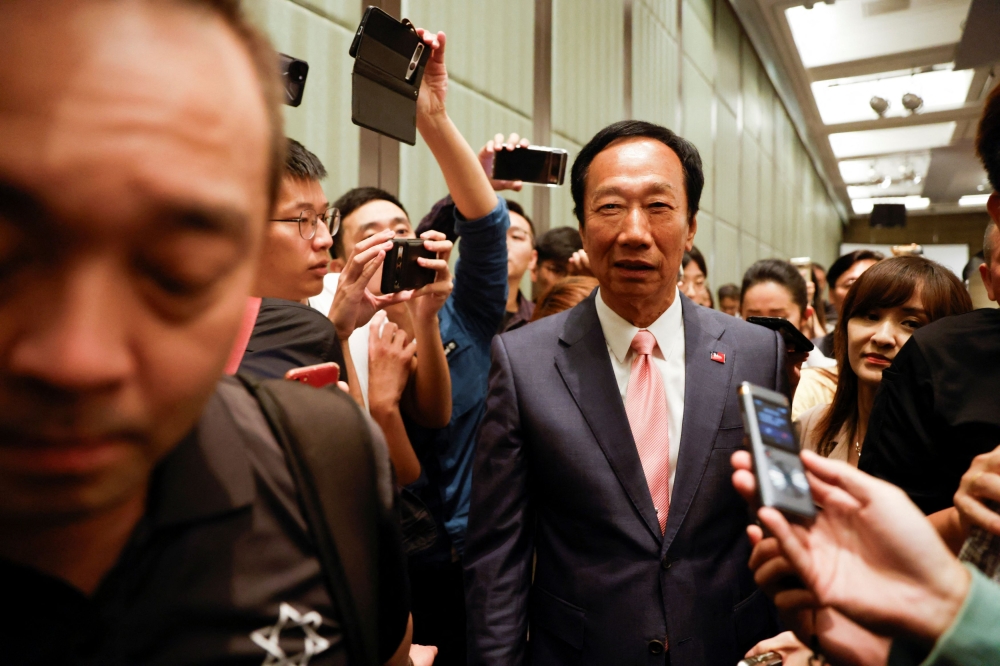 Terry Gou, Foxconn founder and presidential candidate, walks among media members during a press conference in Taipei, Taiwan November 23, 2023. — Reuters pic