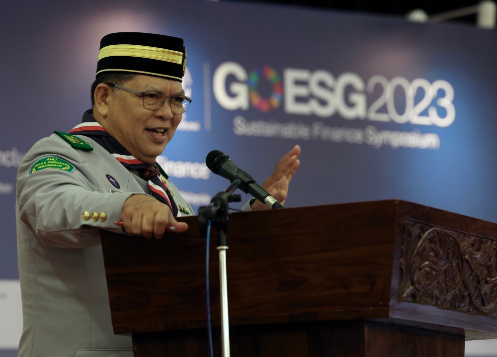 Dewan Rakyat Speaker Tan Sri Johari Abdul delivers an opening keynote address during the Go Sustainable Finance Symposium GoESG 2023 at Parliament, November 24, 2023. — Bernama pic 