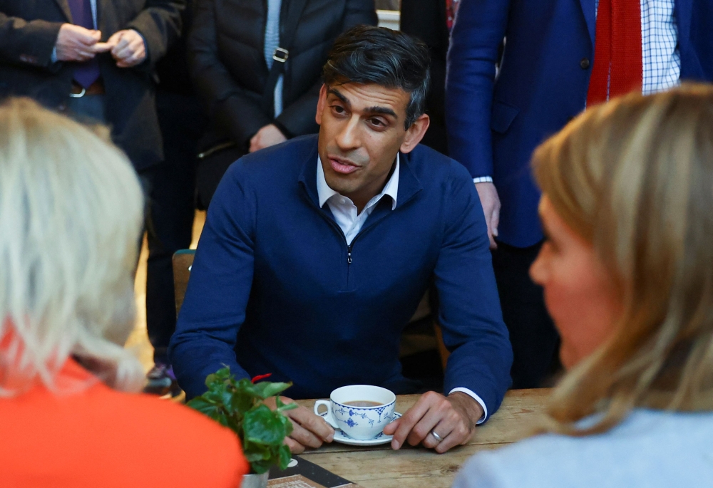 British Prime Minister Rishi Sunak meets with small business owners from Sunny Bank Mills, at The Emma White Jewellery Studio in Sunny Bank Mills, Farsley November 23, 2023. — Molly Darlington/Pool/Reuters pic
