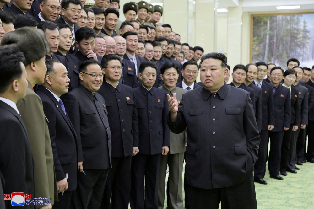 North Korea's leader Kim Jong-un meets with members of the Non-Standing Satellite Launch Preparation Committee, in this picture released by the Korean Central News Agency on November 24, 2023. ― KCNA via Reuters