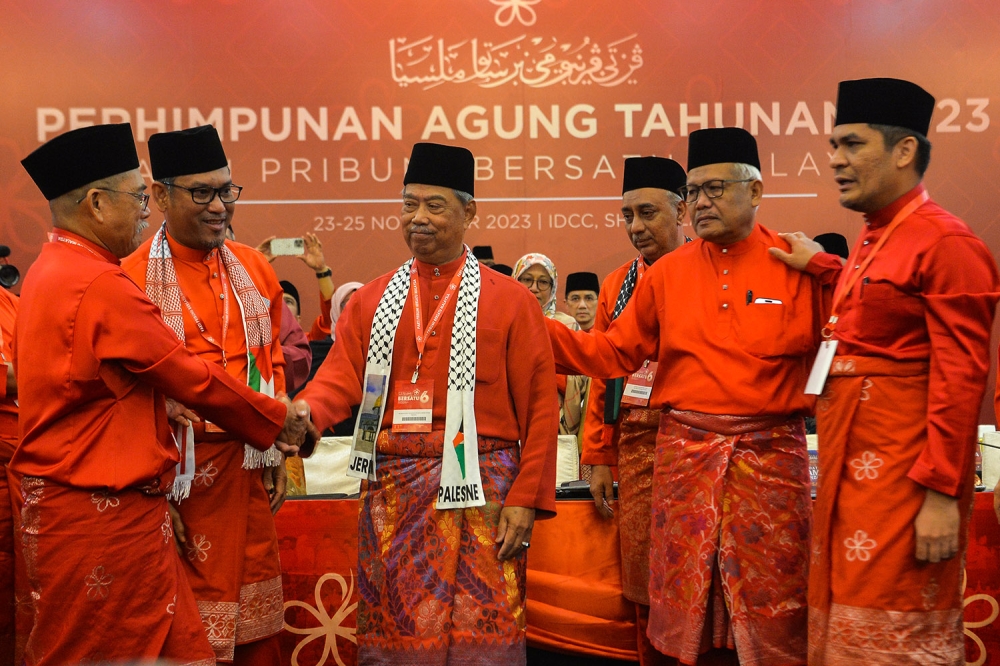 Parti Pribumi Bersatu Malaysia president Tan Sri Muhyiddin Yassin (centre) and other party leaders during the party’s annual general assembly held at the Ideal Convention Centre in Shah Alam November 25, 2023. — Picture by MIera Zulyana