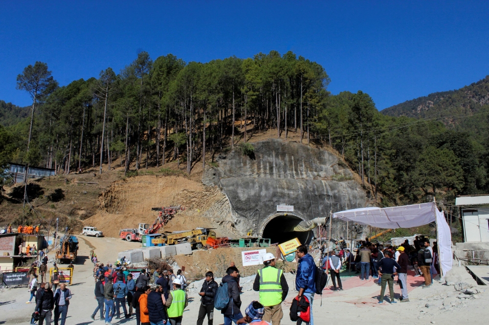 Media personnel and onlookers gather near the entrance of a tunnel under construction where workers are trapped following a collapse, in Uttarkashi, in the northern state of Uttarakhand, India, November 24, 2023. ― Reuters pic