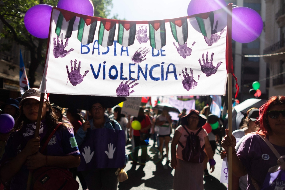 Thousands of people took to the streets across the world yesterday to condemn violence against women on the international day highlighting the crime. — AFP pic