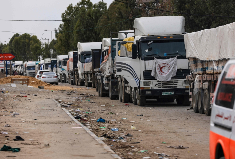 A convoy of trucks carrying fuel and aid drive in Gaza City’s Zeitoun district on November 25, 2023, on the second day of a truce between Israel and Hamas. — AFP