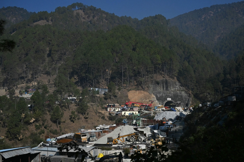 Uttarakhand chief minister Pushkar Singh Dhami said Saturday that vertical drilling had begun to dig 89 metres downwards, a risky route above the men in an area that has already suffered a collapse. — AFP pic