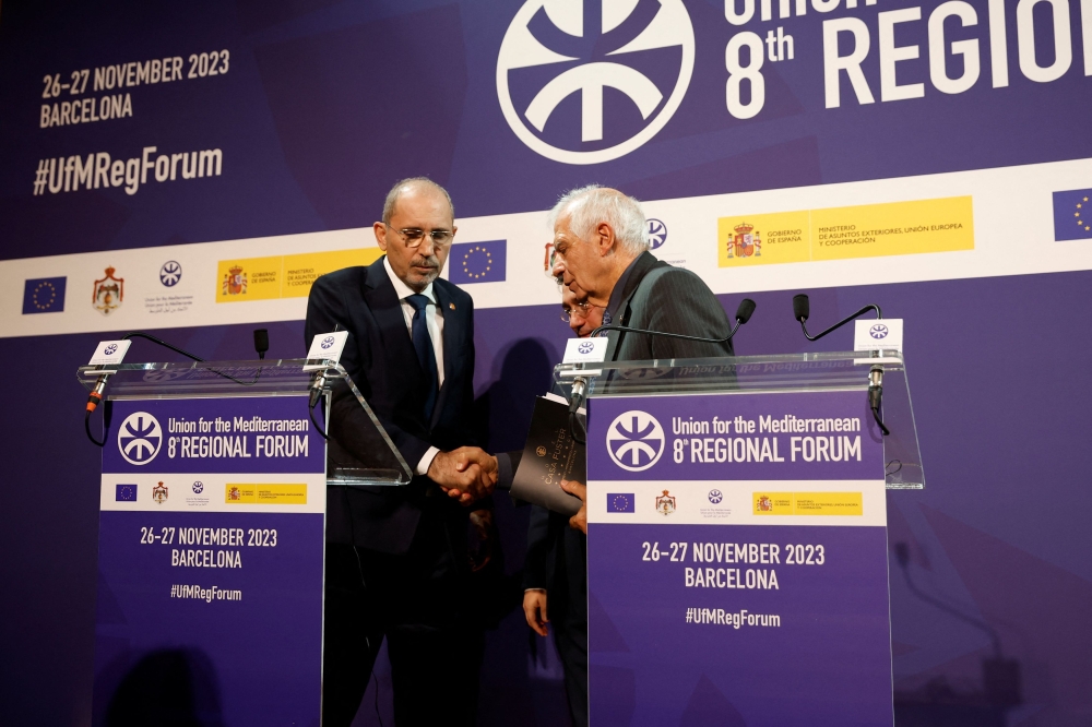 Jordanian Foreign Minister Ayman Safadi shakes hands with European Union's High Representative for Foreign Affairs and Security Policy Josep Borrell after a press conference at the Union for the Mediterranean summit, in Barcelona, Spain, November 27, 2023. — Reuters pic