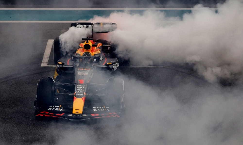 Red Bull’s Max Verstappen performs a burnout after winning the Abu Dhabi Formula One Grand Prix at the Yas Marina Circuit, November 26, 2023. — Reuters pic 