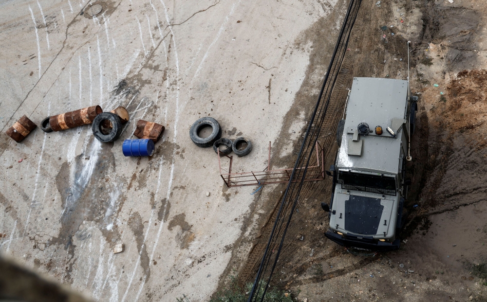 An Israeli military vehicle manoeuvers during a raid in Tubas in the Israeli-occupied West Bank November 28, 2023. — Reuters pic