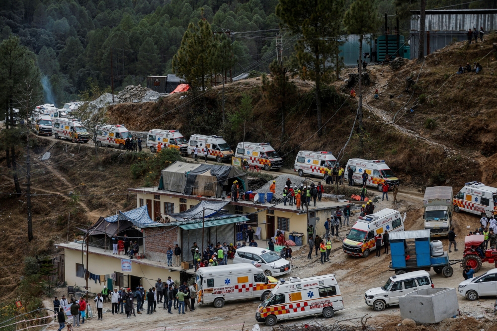 Ambulances wait in line to enter a tunnel where rescue operations are underway to rescue trapped workers, after the tunnel collapsed, in Uttarkashi in the northern state of Uttarakhand, India, November 28, 2023. — Reuters pic