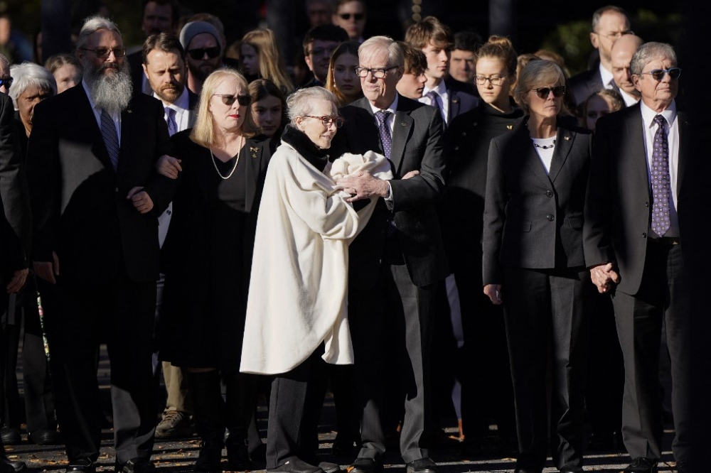 Members of the Carter family watch as the casket of former first lady Rosalynn Carter arrives at the Jimmy Carter Presidential Library and Museum on November 27, 2023 in Atlanta. — Pool pic via APF