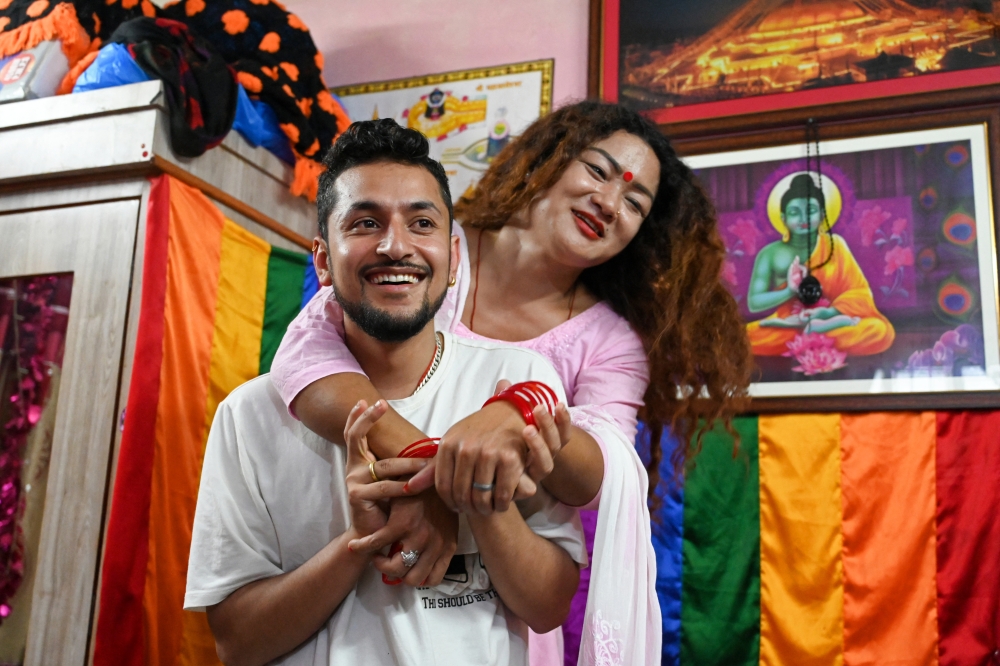 Surendra Pandey (left) and Maya Gurung, a transgender woman, take part in an interview with AFP in Kathmandu in this picture taken on August 30, 2023. — AFP pic