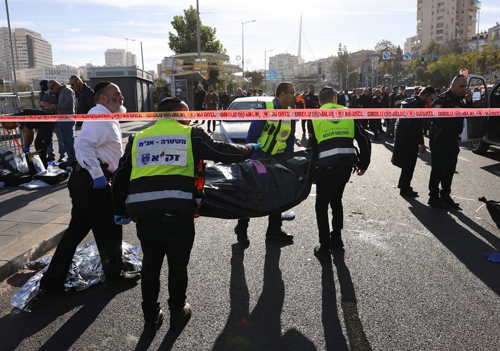 Israeli officials work at the scene of a violent incident in Jerusalem November 30, 2023. — Reuters pic