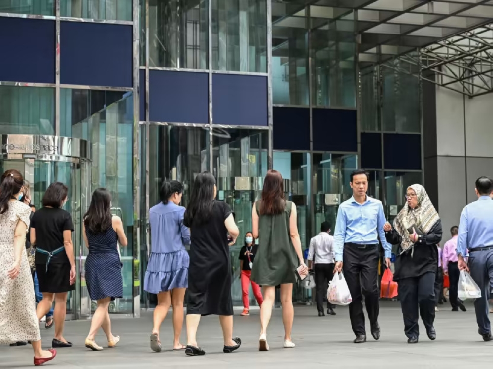 A lunchtime crowd is seen at Raffles Place in Singapore on Feb 16, 2023. — AFP pic