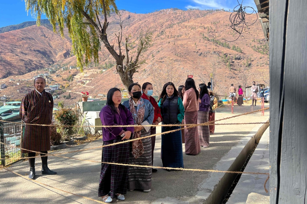 Bhutan voted today in primary polls to choose the top two political parties who will contest only the fourth-ever general election in the tiny Himalayan kingdom’s history. — AFP pic