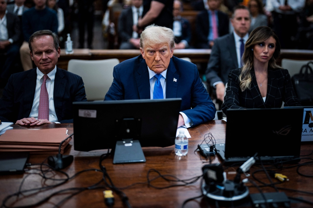 Former US President Donald Trump prepares to testify during his trial at New York State Supreme Court in New York on November 6, 2023. — AFP pic
