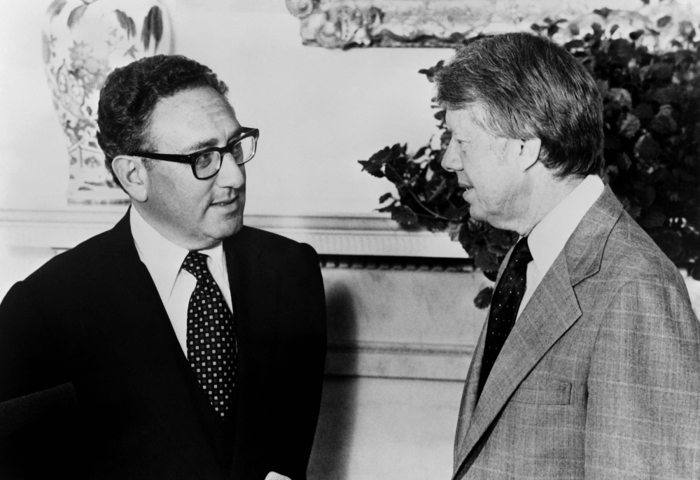 US President Jimmy Carter (R) meets former Secretary of State Henry Kissinger to discuss Middle East peace proposals at the White House in Washington on August 15, 1977. Former US secretary of state Henry Kissinger, a key figure of American diplomacy in the post-World War II era, died November 29, 2023 at the age of 100, his association said. — AFP file pic