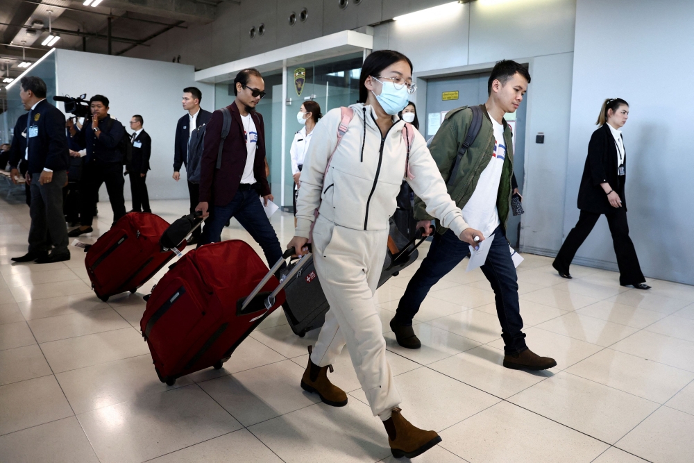 Nattawaree Mulkan, 36, the only woman released as a part of the first batch of Thai nationals by the Palestinian group Hamas, walks after being held for nearly two months in Gaza, at Bangkok's Suvarnabhumi airport in Thailand November 30, 2023. — Reuters pic