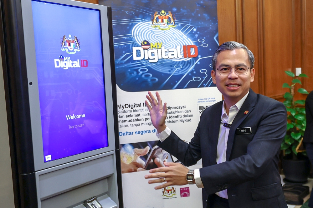 Communications  and Digital Fahmi Fadzil said the public need not worry about the implementation of Digital ID as it does not require recording of biometric identifiers, such as fingerprints, as well as facial recognition, and iris scans of users. — Bernama pic  