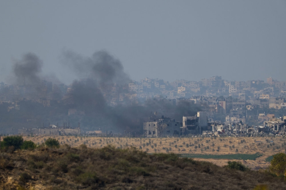 Smoke rises in Gaza  following an Israeli strike, after a temporary truce between Israel and the Palestinian Islamist group Hamas expired, as seen from southern Israel, December 1, 2023. — Reuters pic