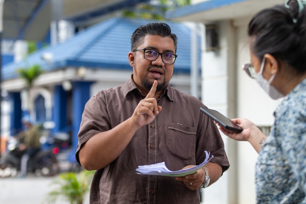 Badrul Hisham Shaharin, known as Chegubard, responds to police inquiries at Bukit Aman regarding his characterisation of Prime Minister Datuk Seri Anwar Ibrahim as ‘dajjal’, a false prophet in Islamic ethos December 1, 2023. — Picture by Raymond Manuel