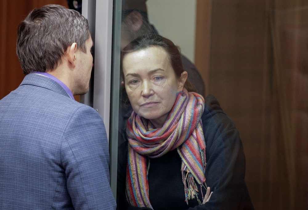 Russian-American journalist for Radio Free Europe/Radio Liberty (RFE/RL) Alsu Kurmasheva, who is in custody after she was accused of violating Russia's law on foreign agents, listens to a lawyer while standing inside an enclosure for defendants as she attends a court hearing in Kazan December 1, 2023. — Reuters pic