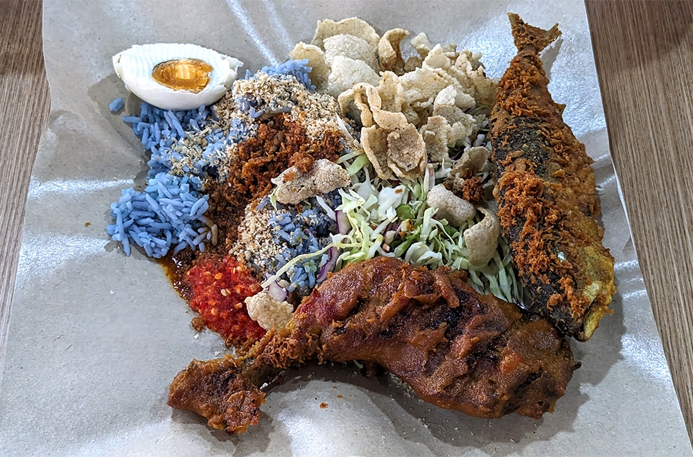Nasi Kerabu Ayam Percik with additional Ikan Goreng Tepung at Restoran Bok’s Kito. — Pictures by Ethan Lau