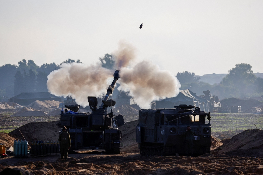 Israeli forces and Hezbollah fighters exchanged heavy fire across the Israel-Lebanon border throughout Saturday as hostilities intensified following the collapse of a truce in Gaza between Palestinian group Hamas and Israel. — Reuters pic