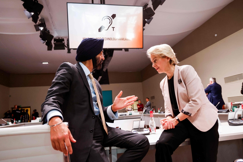 World Bank President Ajay Banga (left) speaks with European Commission President Ursula von der Leyen before a meeting on the 'Coal Transition Accelerator Initiative' at the COP28 United Nations climate summit in Dubai December 2, 2023. — AFP pic