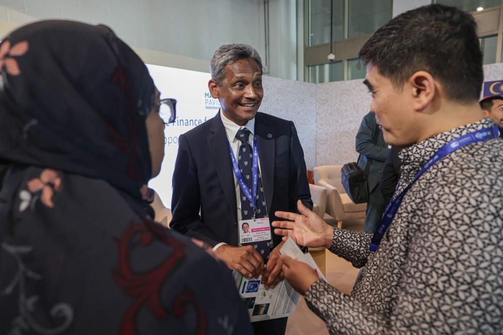 Bank Negara Malaysia Governor Datuk Abdul Rasheed Ghaffour shares a light moment with participants at a forum on Leveraging Islamic Finance for Sustainability: Opportunities and Best Practices held at the Malaysia Pavilion during the 28th Conference of Parties (COP28) to the United Nations Framework Convention on Climate Change, in Dubai Expo City December 3, 2023. — Bernama pic