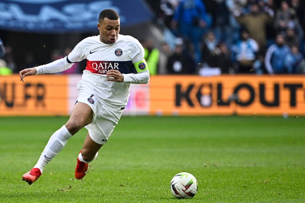 Paris Saint-Germain's French forward #07 Kylian Mbappe runs with the ball during the French L1 football match between Le Havre AC and Paris Saint-Germain (PSG) at The Stade Oceane in Le Havre, north-western France, on December 3, 2023. — AFP pic