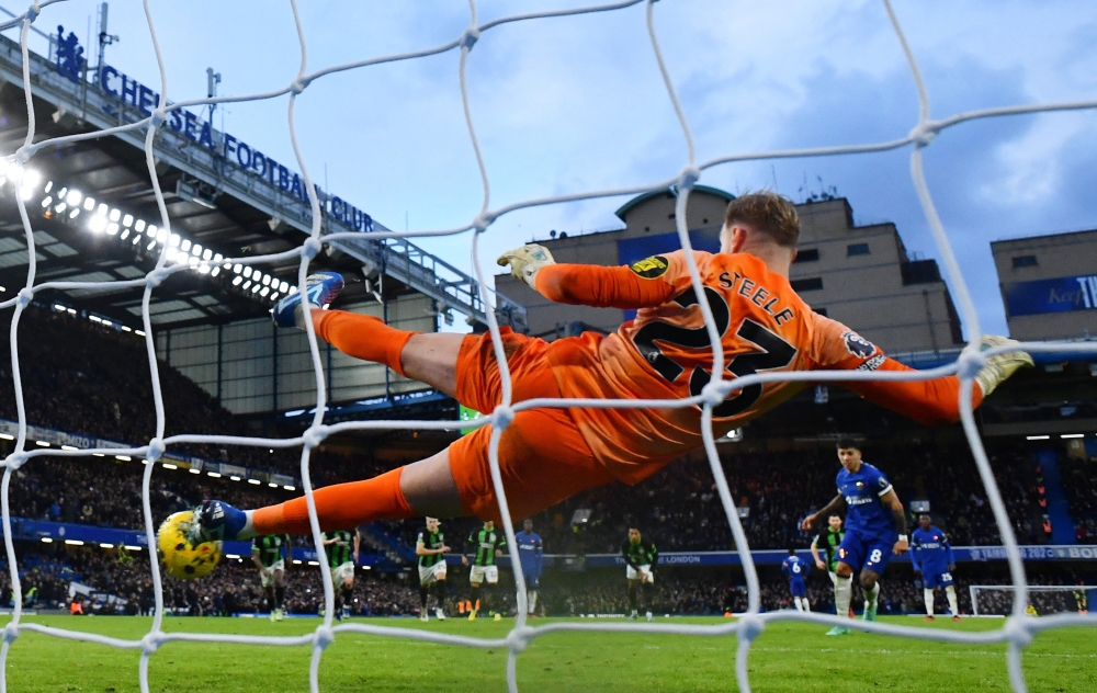 Chelsea's Enzo Fernandez scores their third goal from the penalty spot past Brighton & Hove Albion's Jason Steele. — Reuters pic