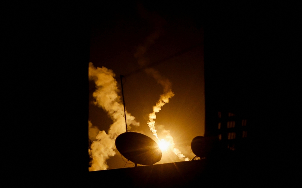 Flares fired by the Israeli military fly above Khan Younis, amid the ongoing conflict between Israel and the Palestinian Islamist group Hamas, in the southern Gaza Strip, December 3, 2023. — Reuters pic