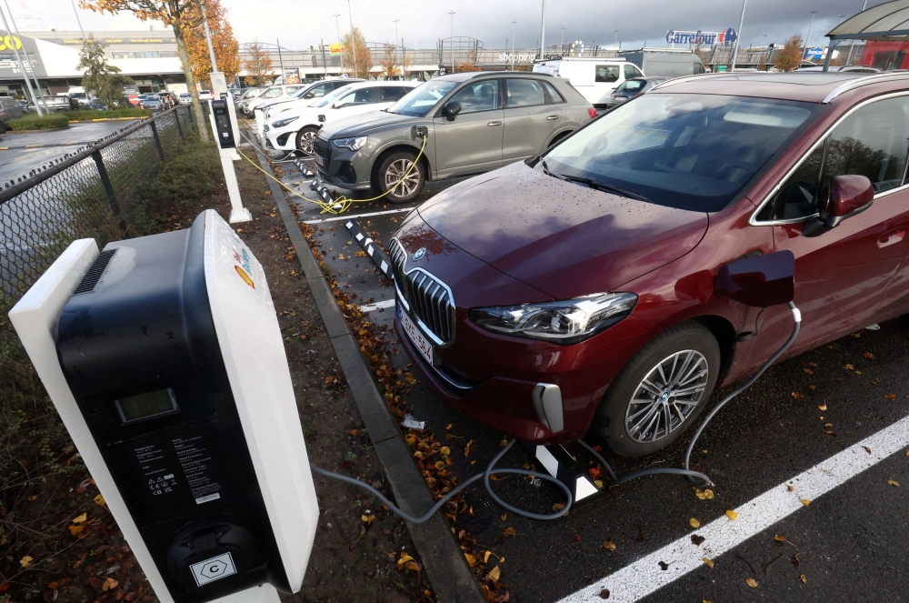  A BMW electric vehicle is being charged in a charging station in Drogenbos, Belgium November 25, 2023. — Reuters pic
