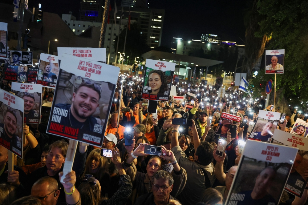 Relatives and supporters of hostages kidnapped on the deadly October 7 attack by Palestinian Islamist group Hamas, rally for their release, after a temporary truce between Israel and the Palestinian Islamist group Hamas expired, in Tel Aviv December 2, 2023. — Reuters pic