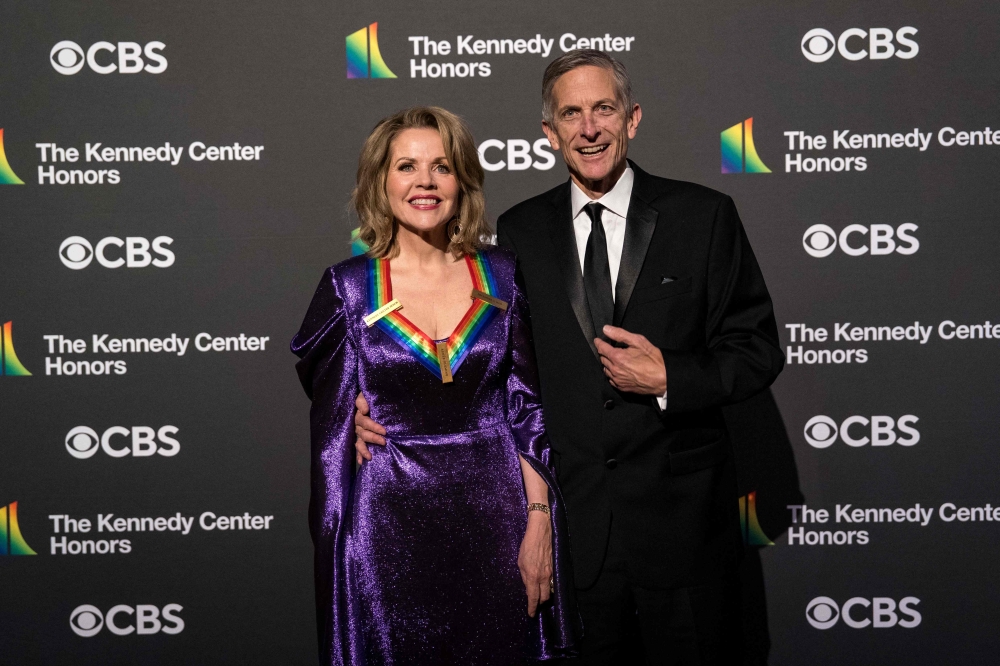 Honoree US opera soprano Renee Fleming and husband Tim Jessell attend the 46th Kennedy Centre Honours gala at the Kennedy Centre for the Performing Arts in Washington, DC, on December 3, 2023. — AFP pic