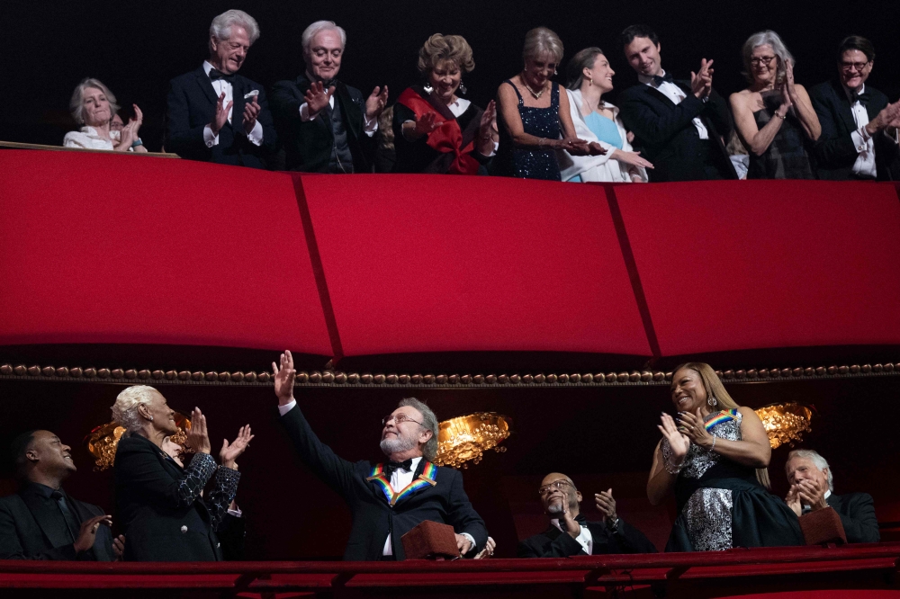 Honorees Dionne Warwick and Queen Latifah clap for Billy Crystal during the 46th Kennedy Centre Honours at the Kennedy Centre December 3, 2023, in Washington, DC. — AFP pic