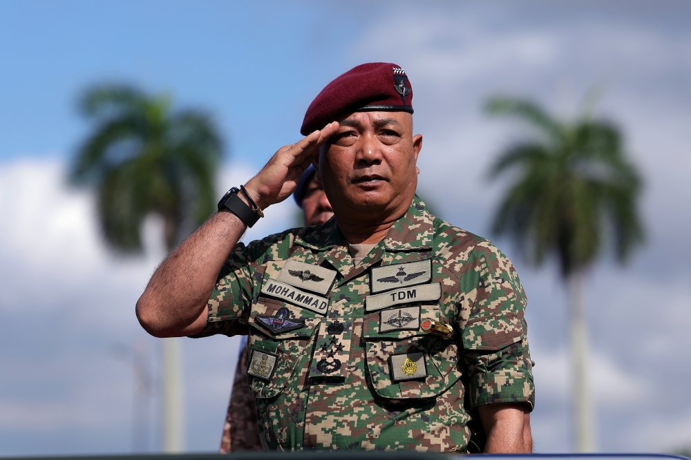 Chief of Defence Force Gen Tan Sri Mohammad Ab Rahman salutes while inspecting the guard after launching the Malbatt 850-10 medal presentation and disbandment ceremony at the Army Basic Training Centre (Pusasda) in Port Dickson, December 4, 2023. — Bernama pic 