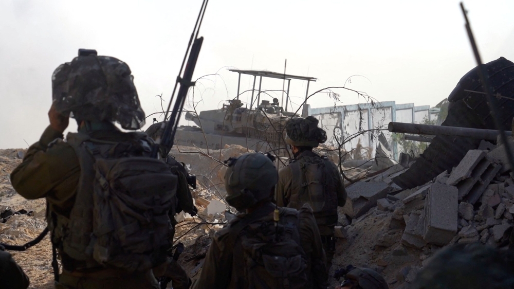 Israeli soldiers take position during the ongoing ground operation of the Israeli army against Palestinian Islamist group Hamas, in a location given as Jabalya, in Gaza, in this handout still image obtained from a video released on December 2, 2023. — Israel Defense Forces/Handout via Reuters pic