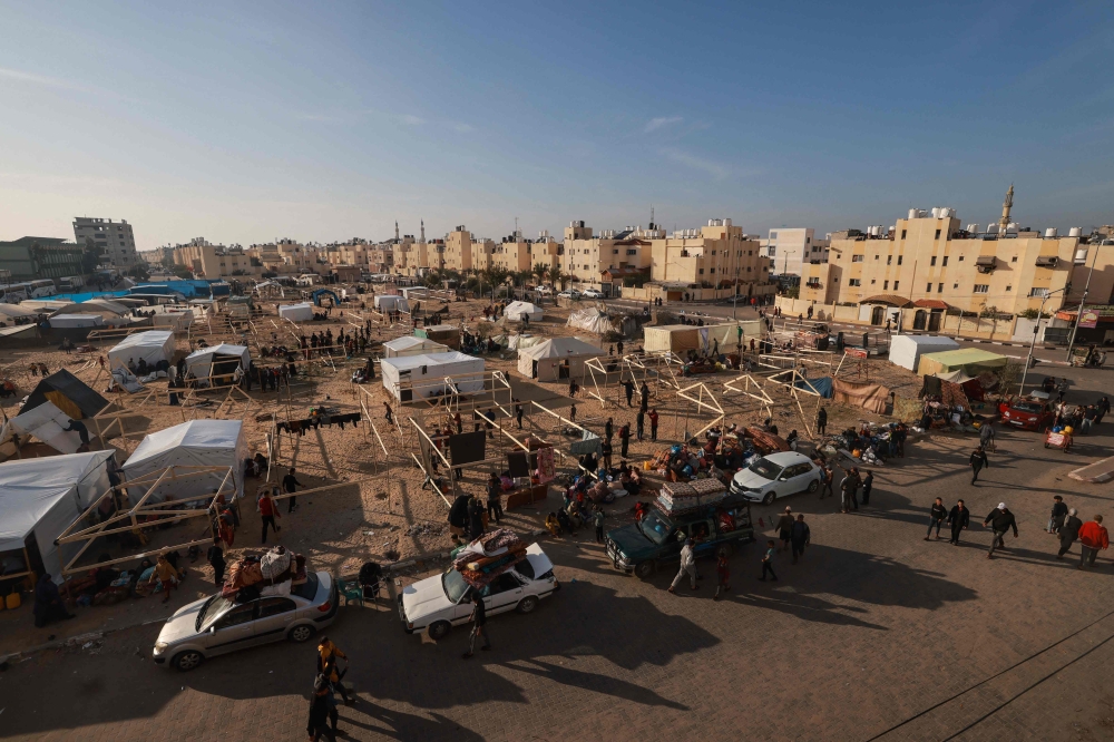 Displaced Palestinians fleeing central and southern Gaza set up tents in the new Tall el-Sultan camp west of Rafah in the southern Gaza Strip, on December 3, 2023, amid continuing battles between Israel and the Hamas.— AFP pic