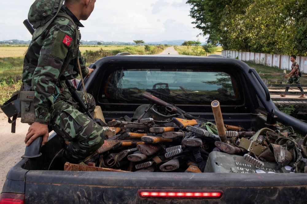 A member of the Karenni Army rides a truck with sized weapons during a battle in Loikaw in Kayah State, Myanmar November 12, 2023. — Reuters pic