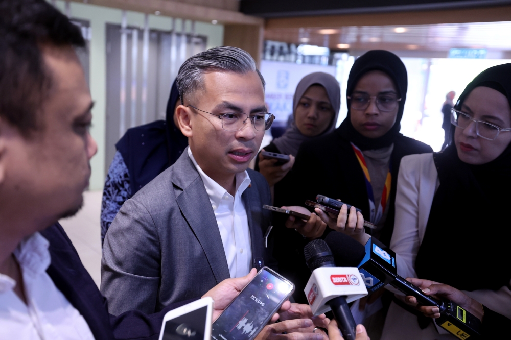 Minister of Communications and Digital Fahmi Fadzil speaks to reporters in Kuala Lumpur December 5, 2023. — Bernama pic