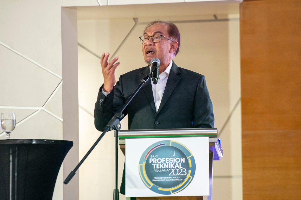 Prime Minister Datuk Seri Anwar Ibrahim delivers a speech during the officiation of the National Technical Profession Day, in Putrajaya December 5, 2023. — Picture by Shafwan Zaidon