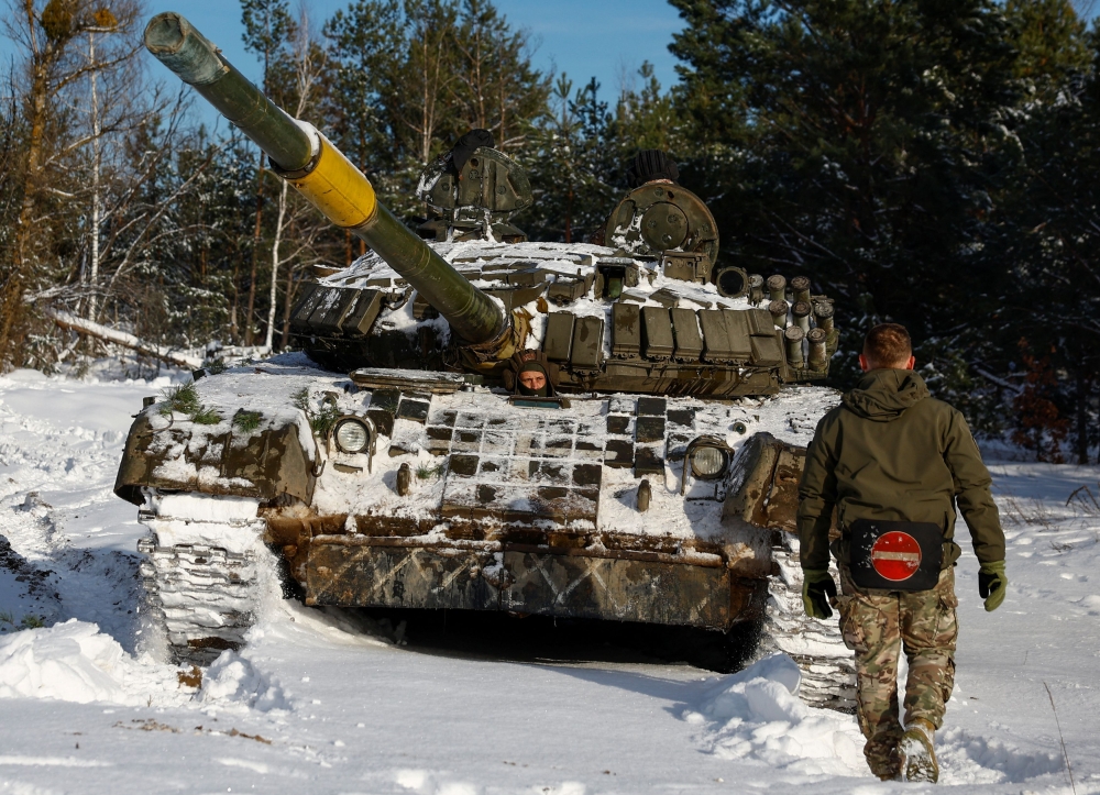 A Ukrainian serviceman drives a tank during anti-sabotage drills, amid Russia's attack on Ukraine, in Chernihiv region, Ukraine December 5, 2023. ― Reuters pic