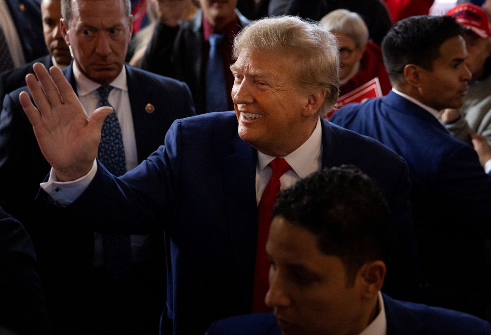 Republican presidential candidate Trump had to be asked twice during a televised town hall event in Iowa to deny that he would abuse power to seek revenge on political opponents if re-elected to the White House. ― Reuters pic